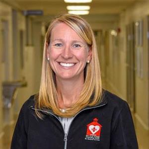 School Nurse Nicole Ewing smiles in hallway 